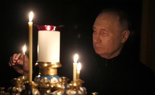 普京哀悼莫斯科近郊恐袭遇难者 烛光中祈祷(图)